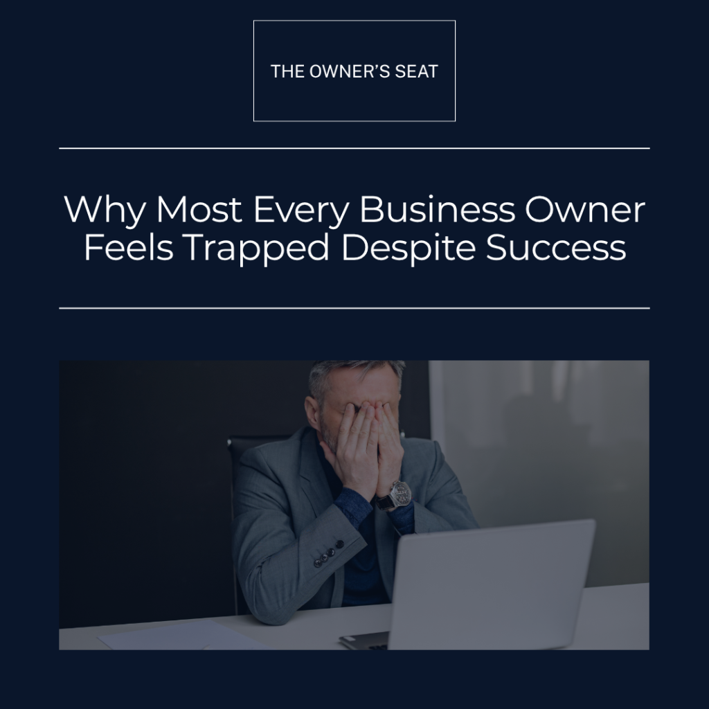 Business owner sitting at desk overwhelmed despite running a profitable company — Fox Business Coaching